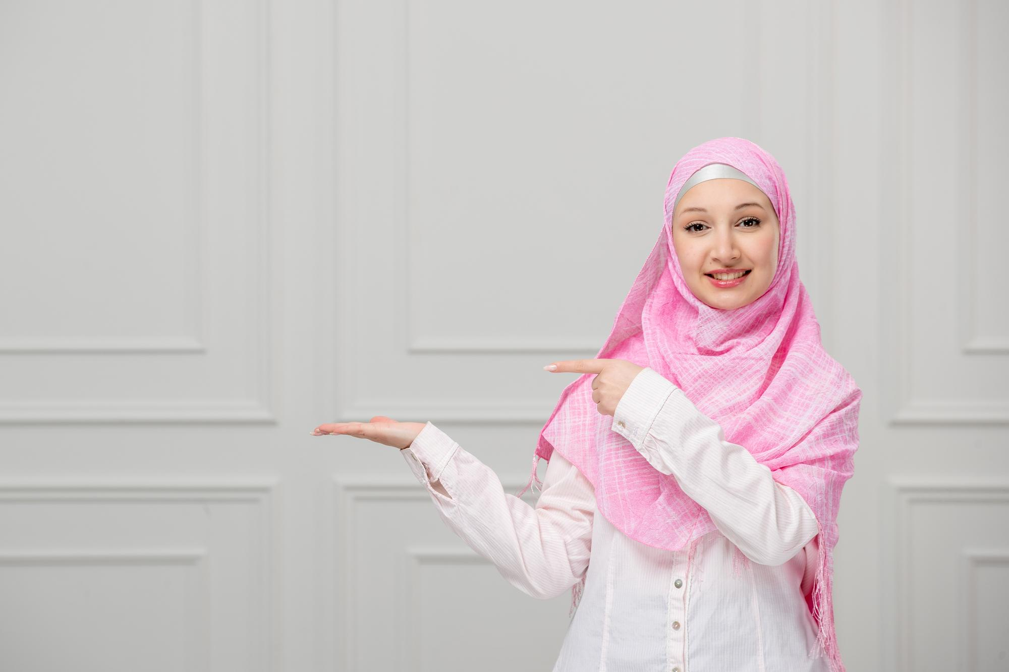 arabic-girl-pretty-cute-young-muslim-woman-wrapped-beautiful-pink-hijab-pointing-left