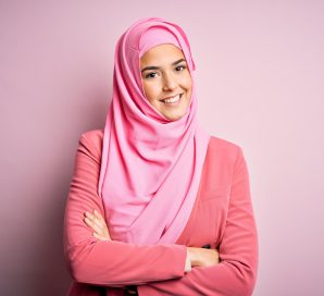 young-beautiful-girl-wearing-muslim-hijab-standing-isolated-pink-background-happy-face-smiling-with-crossed-arms-looking-camera-positive-person